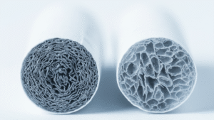 Microscopic cross-section view of two circular filter structures showing detailed internal texture and porous material composition under magnification